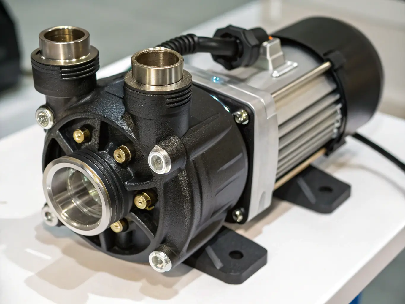 An image of a complete monobloc pump system installed in an industrial setting, showing its compact design and efficient operation, with pipes and electrical connections visible.